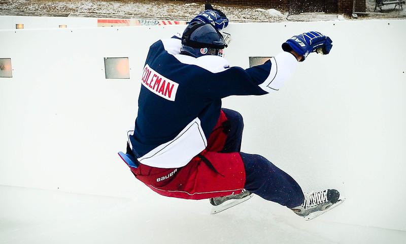 Mayor Coleman crashes into the boards. (Pioneer Press: Ben Garvin)