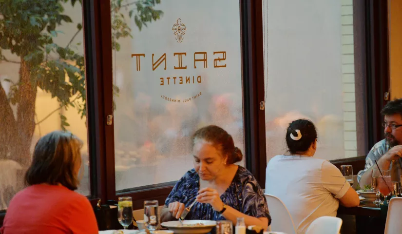 Guests enjoy brunch as they watch the a late morning thunderstorm from the windows of the Saint Dinette in St. Paul’s Lowertown district on Saturday, July 23, 2016. (Pioneer Press: John Autey)