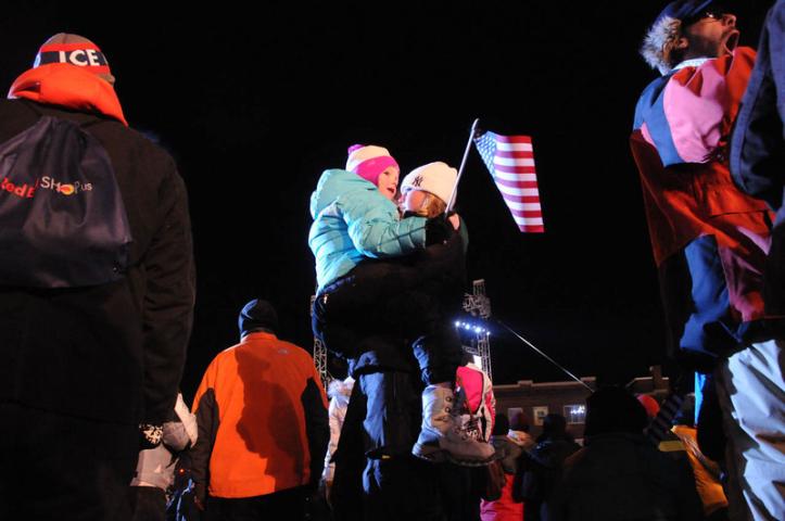 Ashley Volkenant holds her 5 year-old daughter Alexis in her arms so she can see the  Red Bull Crashed Ice Ice Cross Downhill World Championship 2014. (Pioneer Press: Sherri LaRose-Chiglo)