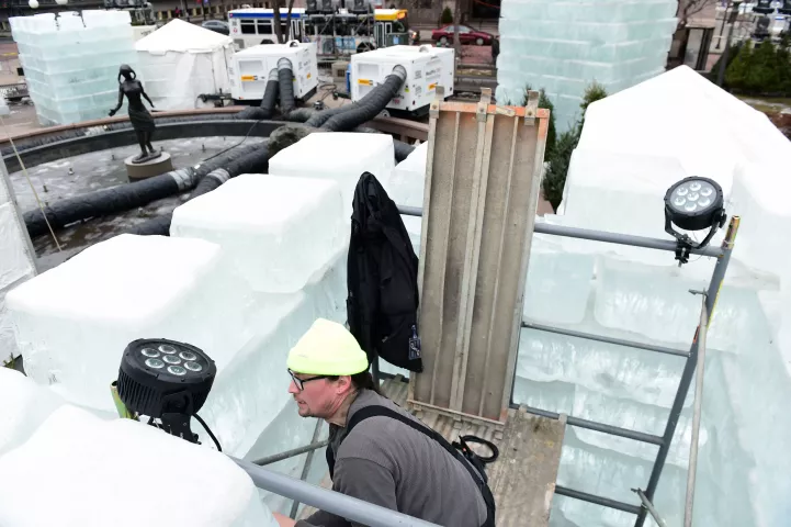 Nathan Aasness of Showcore Inc. installs lighting in the Winter Carnival Ice Castle under construction Tuesday, Jan. 24, 2017, in St. Paul's Rice Park. (Pioneer Press: Scott Takushi)