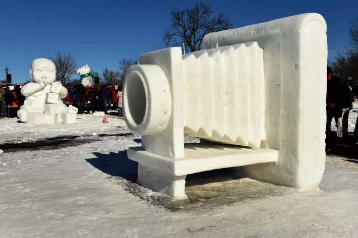 At right is "Focused on a Cure For MS" by Kurtis Klett, Keith Klett and Mike Leider, at left is "Playtime" by Bill Wegwerth, Dan Ross and Weston Johnson which won the Artist's Choice and Vulcans' Choice award a the Minnesota State Snow Sculpting Competition. (Pioneer Press: Scott Takushi)