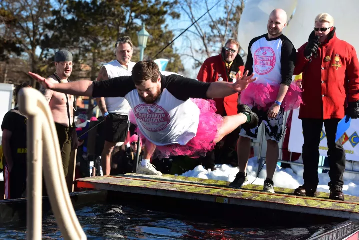 Tyler Splittgerber dives into a pool of very cold water at the Snow Park Plunge at the Minnesota State Fairgrounds in Falcon Heights, part of the 2017 St. Paul Winter Carnival's events, Sunday, Jan. 29, 2017. (Pioneer Press: Scott Takushi)