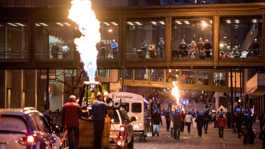Crowds line the streets of downtown St. Paul on Saturday, Feb. 4, 2017, to watch the flaring of torches as part of the annual Winter Carnival Vulcan Victory Torchlight Parade. (Andy Rathbun / Pioneer Press)