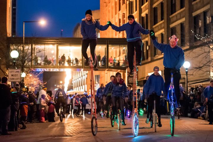 Unicyclists participate in the Winter Carnival Vulcan Victory Torchlight Parade in downtown St. Paul on Saturday, Feb. 4, 2017. Crowds lined the streets to watch the annual parade, which celebrates the Vulcans’ overthrow of King Boreas. (Pioneer Press: Andy Rathbun)