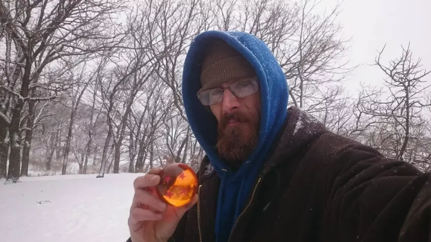 Treasure hunter Ed Brodie poses with a “Dragon Ball” from Sumo Egg Rolls food truck he found while medallion hunting in the annual Pioneer Press Treasure Hunt Wednesday, Jan. 25, 2017. (Photo courtesy Ed Brodie)