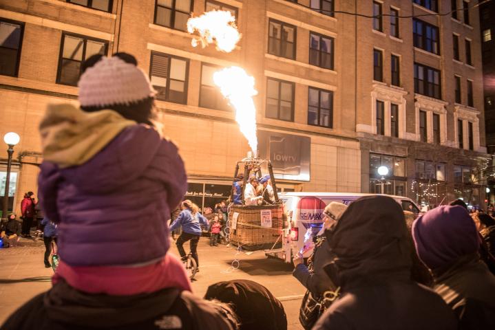 Spectators watch a flame leap into the air during the Winter Carnival Vulcan Victory Torchlight Parade in downtown St. Paul on Saturday, Feb. 4, 2017. (Pioneer Press: Andy Rathbun)