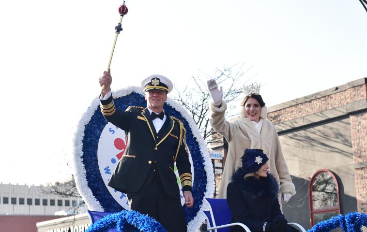 Tom Leonard, King Boreas LXXXII, and Jilla Nadimi, Aurora, Queen of Snows, wave to the crowds during the 2018 St. Paul Winter Carnival Grand Day Parade in St. Paul on Saturday, Jan 27, 2018. (John Autey / Pioneer Press)