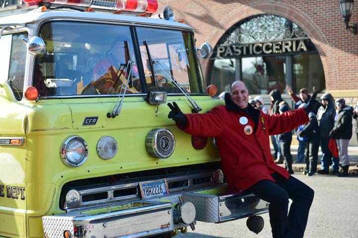 A former Vulcan hitches a ride on the front of a fire truck. (John Autey / Pioneer Press)