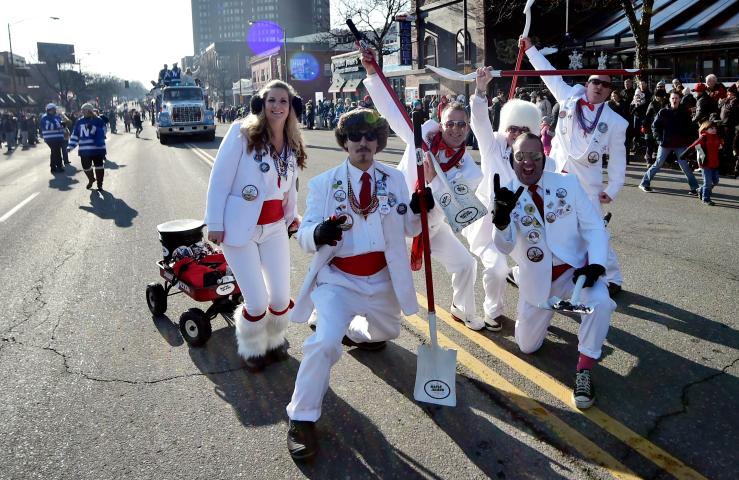 The Tux Team, also known as the Pooper Scoopers team, stops for a photo during the 2018 St. Paul Winter Carnival Grand Day Parade in St. Paul on Saturday, Jan 27, 2018. (John Autey / Pioneer Press)