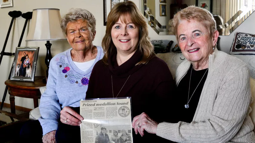 Diane Houle holds the front-page story the Pioneer Press ran after her group found the Treasure Hunt medallion in 1978, when Houle was 12. Her group included her mother, Bev Gerber, right, and Rita Taylor, left, Gerber’s close friend. The two families, who lived across the street from each other in St. Paul, spent their $2,500 winnings on a joint vacation to Florida a month after their victory. The three are pictured at Taylor’s Maplewood home on Tuesday, Jan. 23, 2017, in Maplewood. (Lisa Legge / Pioneer P