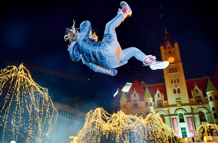 Rice Park and Landmark Center lit up the night sky as Moon Glow Parade-goers were sent skyward by the St. Paul Bouncing Team during the 128th Saint Paul Winter Carnival Moon Glow Parade at Rice Park in St. Paul on Thursday, Jan. 23, 2014. (Pioneer Press: Ben Garvin)