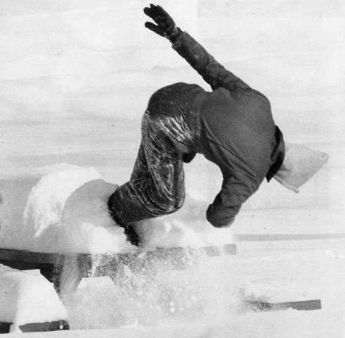 Gravity exists in 1979, too, as Al Johnson meets it as he slips off the Como Park picnic table he was searching around. According to the photo's original caption, he landed "up to his neck in a snowbank." (Pioneer Press file photo)