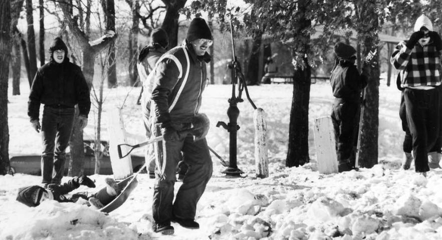 Janna Kollach fights to stay on the sled as her uncle John Darst of Oakdale pulls her through Tony Schmidt Park in Arden Hills while searching for the medallion during the 1988 hunt. (Pioneer Press file photo)