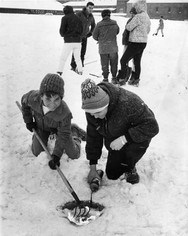 Richard Lang, 11, left, and his brother Greg, 16, of Maplewood use a blowtorch to melt snow in search of the medallion at the State Fairgrounds in 1967. (Pioneer Press file photo)