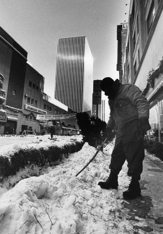 Ron LaValle of St. Paul pokes around in a snowbank at Fifth and Wabasha streets during the 1982 hunt. (Pioneer Press file photo)
