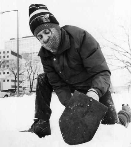Dave Lyons of St. Paul digs for treasure during the 1985 hunt on Kellogg Boulevard near Cedar Street. (Pioneer Press file photo)