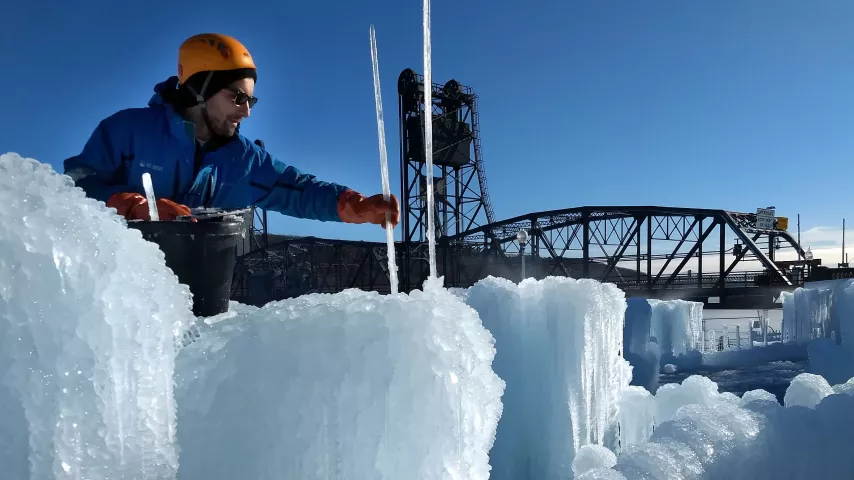 Jake Telschow, an employee of Ice Castles LLC, places an icicle on the new ice castle under construction in downtown Stillwater on Thursday, Dec. 7, 2017.(Courtesy of Ice Castles LLC)