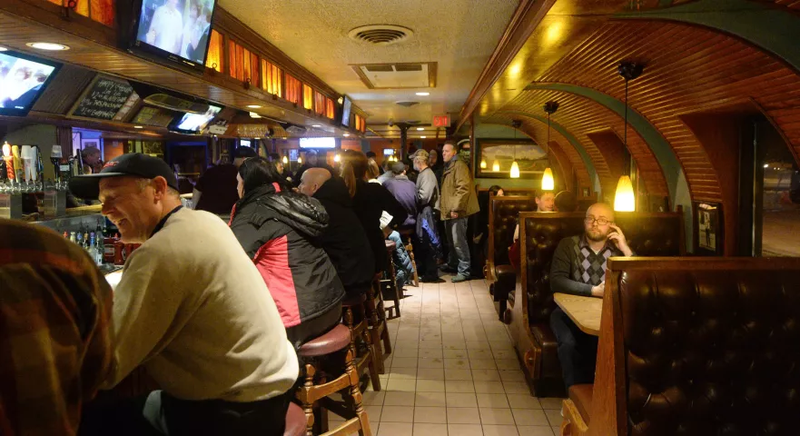Treasure hunters wait for papers containing the final clue in the Pioneer Press Treasure Hunt to be delivered to Gabe's by Park in St. Paul late Wednesday, Feb. 3, 2015, 2016. (Pioneer Press: John Autey)