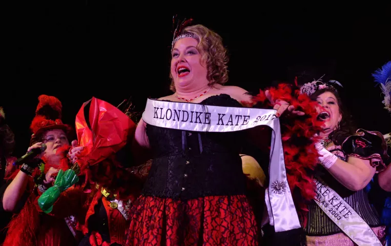 Kristen Oster, center, of West St. Paul, shows off her sash after sh is named the 2017 Klondike Kate during at the Envision Event Center in Oakdale on Wednesday, Jan 11, 2017. (Pioneer Press: John Autey)