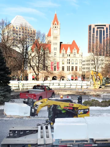 Park Construction Company workers unload 650-pound blocks of ice two at a time off a flatbed truck at the St. Paul Winter Carnival Ice Palace in Rice Park in St. Paul on Monday, Jan. 8, 2018. (Pioneer Press / John Autey)