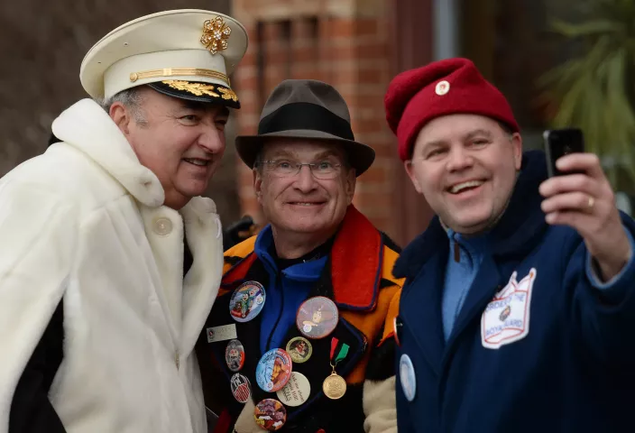 Dick Nicholson, center and John Kupris have their photo taken with a former King Boreas during the St. Paul Winter Carnival Grande Day Parade on Jan. 30. (Pioneer Press: John Autey)
