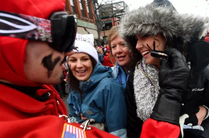 Portland, Ore., resident Molly Krueger, right, gets her first Vulcan "V" along with her aunt, Cheryl Anderson, of Bloomington, middle, and cousin Tammi Hagensick, of Madison, Wis., during the St. Paul Winter Carnival Grande Day Parade on Jan. 30. (Pioneer Press: John Autey)