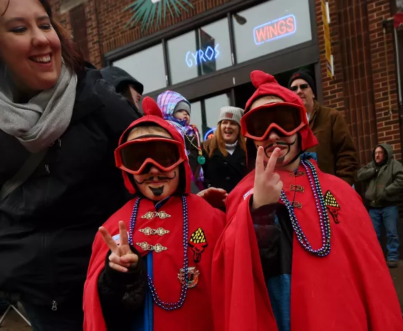 St. Paul mini Vulcans, Liam Schmidt, 5 and his older brother Joe, 7, make the V for Vulcans with their mom Heather at the St. Paul Winter Carnival Grande Day Parade in St. Paul on Jan. 30. (Pioneer Press: John Autey)