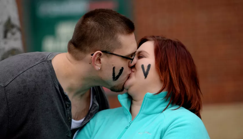 Blaine couple Nick Rose and Breanna Sura share a moment at the St. Paul Winter Carnival Grande Day Parade on Jan. 30. (Pioneer Press: John Autey)