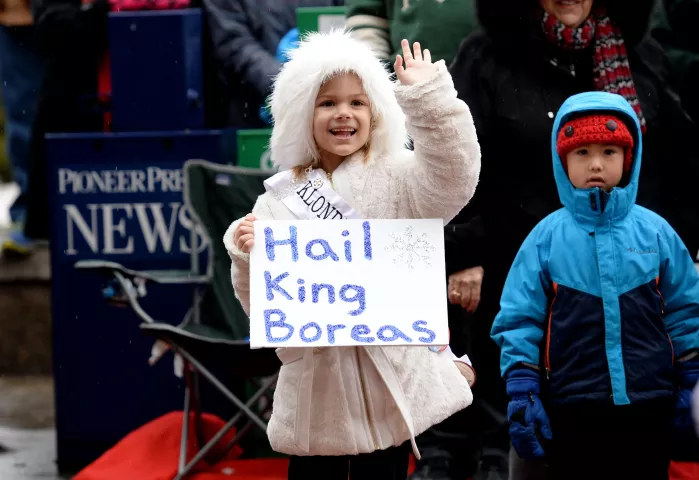 Mio Tubman, 6, of North St. Paul, waves to Shriners as they pass during the St. Paul Winter Carnival Grande Day Parade on Jan. 30. (Pioneer Press: John Autey)