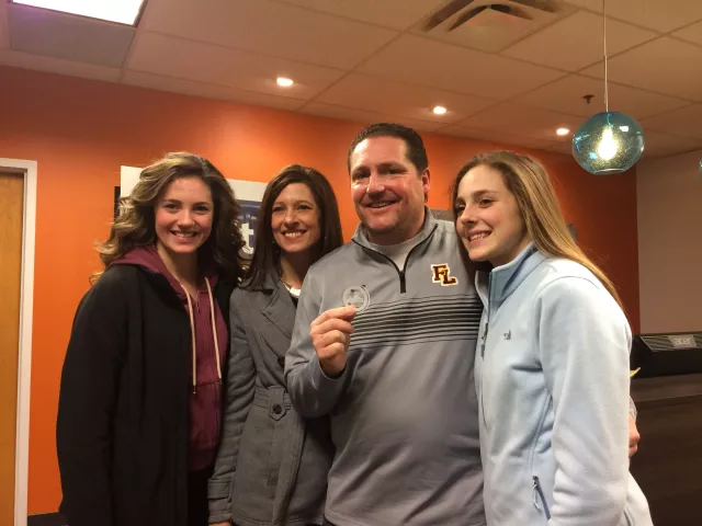 Jerome Krieger holds the 2017 Pioneer Press Treasure Hunt medallion he found while posing with his family, from left, daughter Maddy, wife Jeanne, and daughter, Greta, Monday, Jan. 30, 2017, inside the Pioneer Press offices. Krieger and his family have been searching since 2004, though Krieger found it without their help on Monday. (Pioneer Press: Dave Orrick)