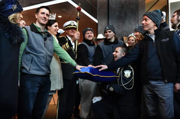 Rob Brass, left, the finder of the medallion, and his team are knighted by the St. Paul Winter Carnival royalty after a press conference for the Pioneer Press Treasure Hunt medallion winner Thursday, Feb. 1, 2018. The medallion was found Wednesday night by the three-time winner. (Jean Pieri / Pioneer Press)