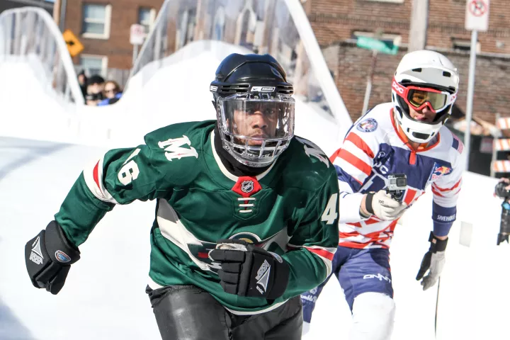 St. Paul Mayor Melvin Carter skates down the Red Bull Crashed Ice track in St. Paul on Thursday, Jan. 18, 2018. Carter, wearing a Minnesota Wild jersey with his name on the back, took several runs down sections of track. (Andy Rathbun / Pioneer Press)