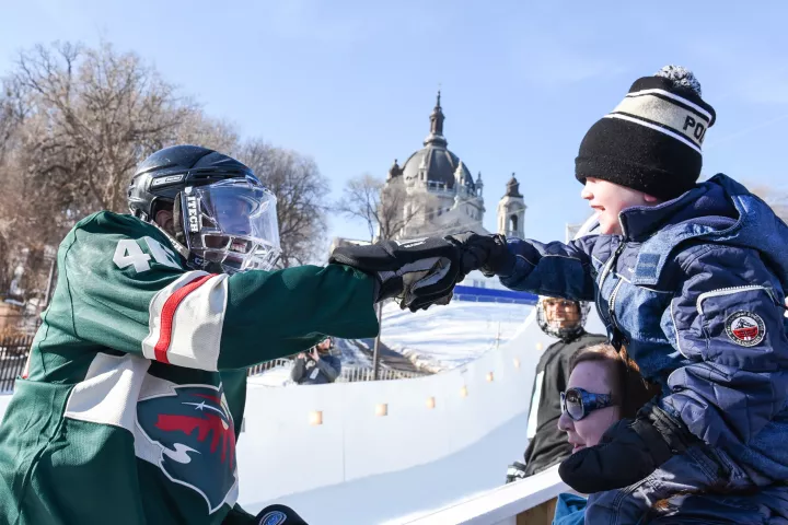 St. Paul Mayor Melvin Carter gives a fist bump to 4-year-old Zane Gilpin of North St. Paul after skating a section of the Red Bull Crashed Ice track in St. Paul on Thursday, Jan. 18, 2018. Tens of thousands of spectators are expected in St. Paul for the Crashed Ice event, which runs Friday and Saturday. (Andy Rathbun / Pioneer Press)