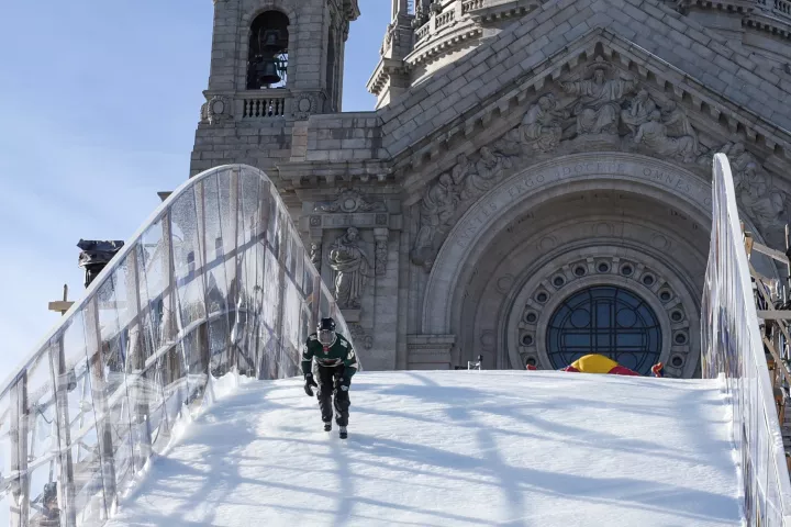 Carter skates down the track. The Cathedral of St. Paul is behind him. (Andy Rathbun / Pioneer Press)