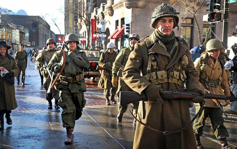Members of the Commemorative Air Force-Minnesota Wing march by the Landmark Center at the Winter Carnival Grande Day Parade in St. Paul, Saturday January 25, 2014. (Pioneer Press: Jean Pieri)