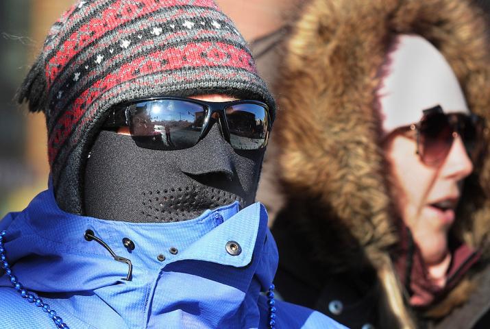 "My husband made me do this," said Cindy Hansen from Eagan about her cold weather head gear at the Winter Carnival Grande Day Parade in St. Paul, Saturday January 25, 2014. She is standing by her daughter, Lindsay Hansen. (Pioneer Press: Jean Pieri)