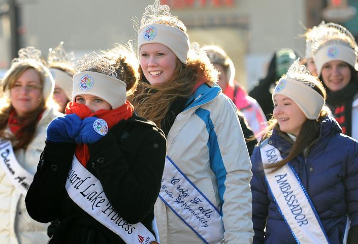 Royalty tries to keep warm as they walk down Seventh Street at the Winter Carnival Grande Day Parade in St. Paul, Saturday January 25, 2014. (Pioneer Press: Jean Pieri)