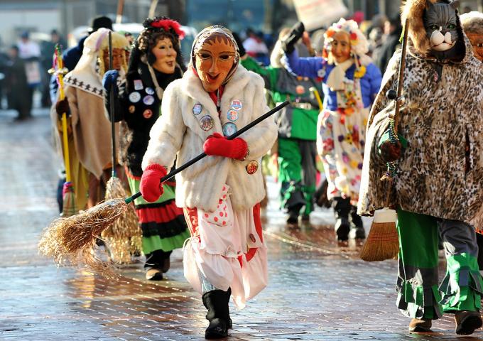 The Narren of New Ulm, a traditional German masked troupe of entertainers and dancers walk down Fifth Street at the Winter Carnival Grande Day Parade in St. Paul, Saturday January 25, 2014. (Pioneer Press: Jean Pieri)