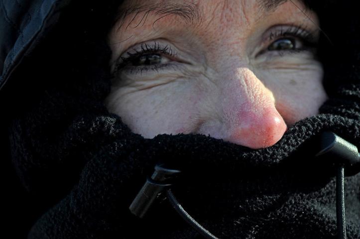 Nancy Wistl's nose turned red while watching the Winter Carnival Grande Day Parade in St. Paul, Saturday January 25, 2014. She is from Maplewood. (Pioneer Press: Jean Pieri)
