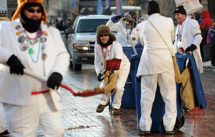The Tux Team happily scoops up after the horses at the Winter Carnival Grande Day Parade in St. Paul, Saturday January 25, 2014. (Pioneer Press: Jean Pieri)