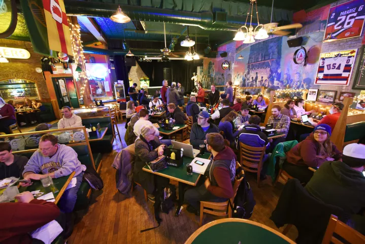 Participants in the annual Pioneer Press Treasure Hunt await early editions of the paper — and a clue to the prized medallion’s whereabouts — inside Shamrocks. (Pioneer Press: Dave Orrick)