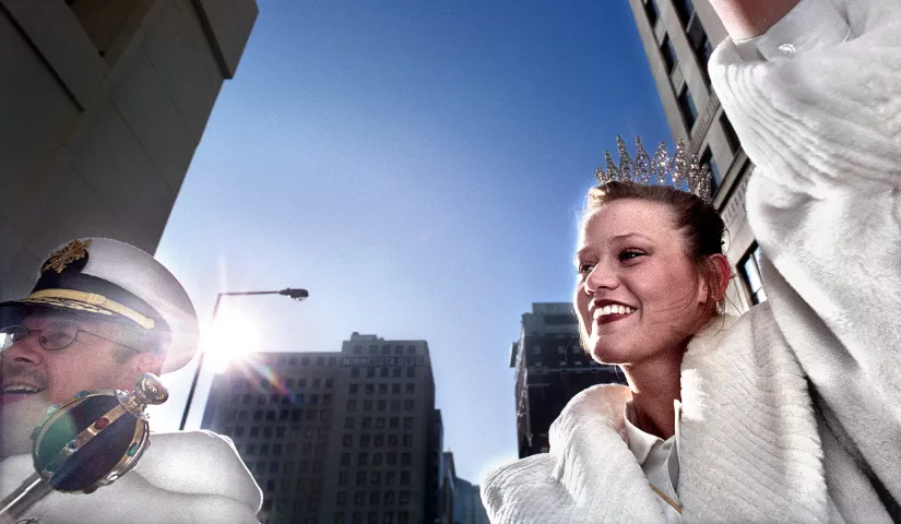 Martha Hill, the 1999 Winter Carnival Queen of the Snows, waves to the crowd at the Grande Day Parade on Saturday, with King Boreas — Pat McCullough — at her side. In the week or so since she was crowned, Hill has learned the life of royalty may be glamorous, but it’s not very relaxing. She has coped with sleep deprivation, a hectic schedule and maintaining the omnipresent graciousness that behooves a queen, but she loves her exciting new world of tiaras and gowns. (Pioneer Press file photo)