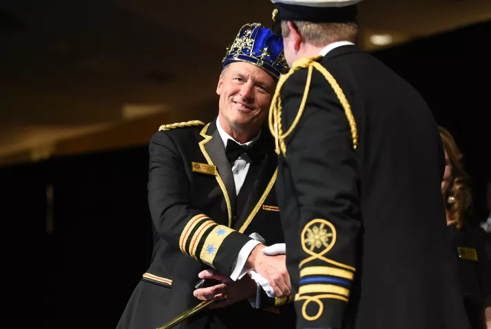 Tom Leonard, Boreas LXXXII, facing, shakes hands with outgoing Boreas LXXX Jason Bradshaw after being crowned at the St. Paul Winter Carnival Royal Coronation at the RiverCentre in St. Paul on Friday, Jan. 26, 2018. (Pioneer Press / John Autey)
