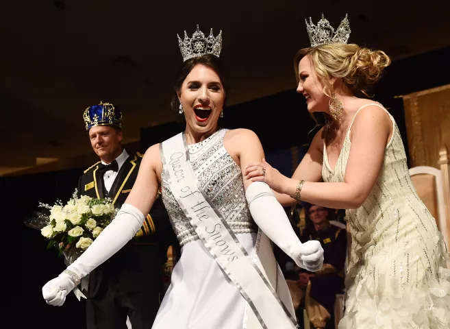 Jilla Nadimi reacts after being crowned Aurora, Queen of Snows by 2017 Queen LIndsey Sandoval at the St. Paul Winter Carnival Royal Coronation at the RiverCentre in St. Paul on Friday, Jan. 26, 2018. (Pioneer Press / John Autey)
