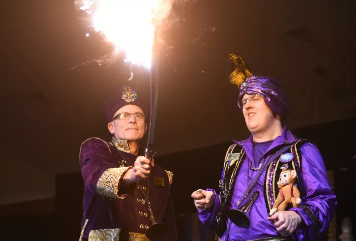 Bill Wearn, 2018 Euros, Prince of the East Wind holds the flaming sword presented to him by 2017 Euros, Prince of the East Wind Brian Laughin at the St. Paul Winter Carnival Royal Coronation at the RiverCentre in St. Paul on Friday, Jan. 26, 2018. (Pioneer Press / John Autey)