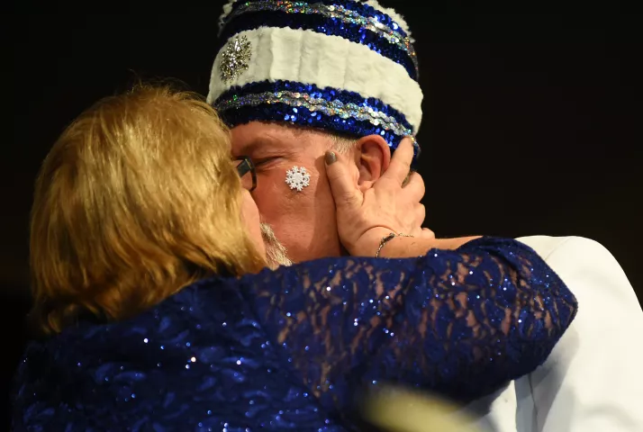 Bob Flood Titan gets a kiss from his wife Cheryl after being announced as the 2018 Prince of the North Wind at the St. Paul Winter Carnival Royal Coronation at the RiverCentre in St. Paul on Friday, Jan. 26, 2018. (Pioneer Press / John Autey)