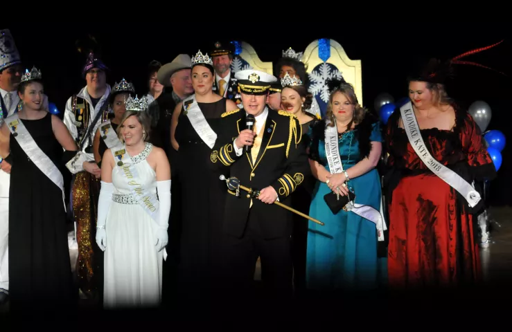King Boreas Jason Bradshaw, center, takes the stage with Aurora Queen of Snows Lindsay Jo Sandoval and other members of the 2017 royal court prior to the 2018 Winter Carnival Coronation Ceremony for the Senior Royalty at St. Paul College Theatre on Friday, Jan. 19, 2018. (Ginger Pinson / Pioneer Press)