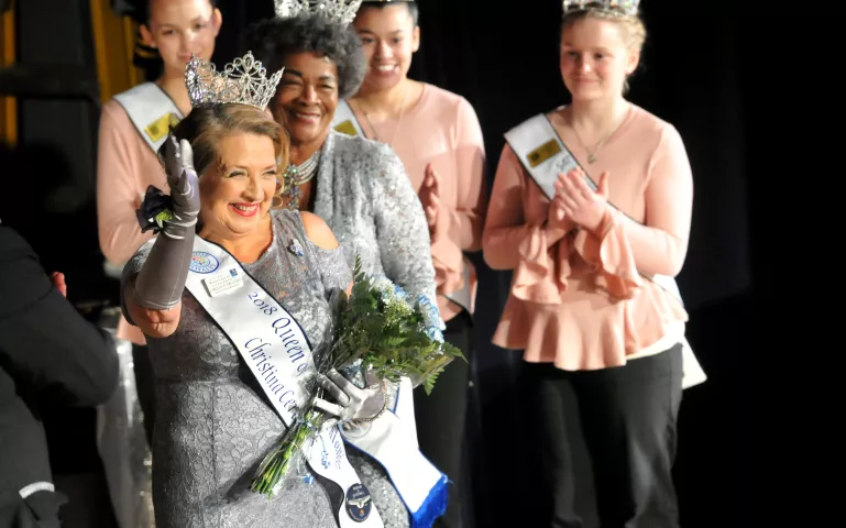 2018 Senior Royalty Queen of the Northlands, Christina Cerecedes, greets the audience after being crowned by last year's Queen, Shirlee Callender, center, during the Winter Carnival Senior Royalty Coronation Ceremonies at St. Paul College Theatre on Friday, Jan. 19, 2018. (Ginger Pinson / Pioneer Press)