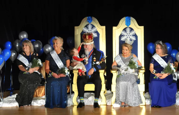 Lydia Schulze, 18 months, wanted in on the action after her grandfather, Dan Monson, was crowned Senior Royalty King Winter the 60th for the 2018 St. Paul Winter Carnival at St. Paul College Theatre on Friday, Jan. 20, 2018. The 2018 Senior Royalty Members are, from left: Shirley Muelken of Oakdale named Prime Minister; Judy Holmquist of Belle Plain, Princess of Four Winds; Dan Monson of St. Paul, King; Christina Cerecedes of Hudson, Queen of the Northlands; and Linda Jones of Burnsville, Lady in Waiting. M