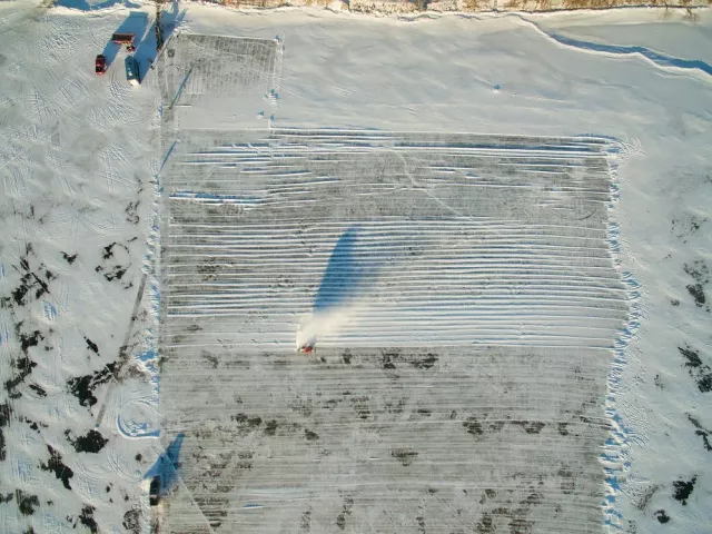 An area of Green Lake near Spicer, Minn., is cleared of snow Monday, Jan. 1, 2018, in preparation for ice harvest. About 4,000 blocks of ice will be cut from the lake for construction of the St. Paul Winter Carnival Ice Palace in Rice Park. (Courtesy of Darrin Johnson / St. Paul Winter Carnival)